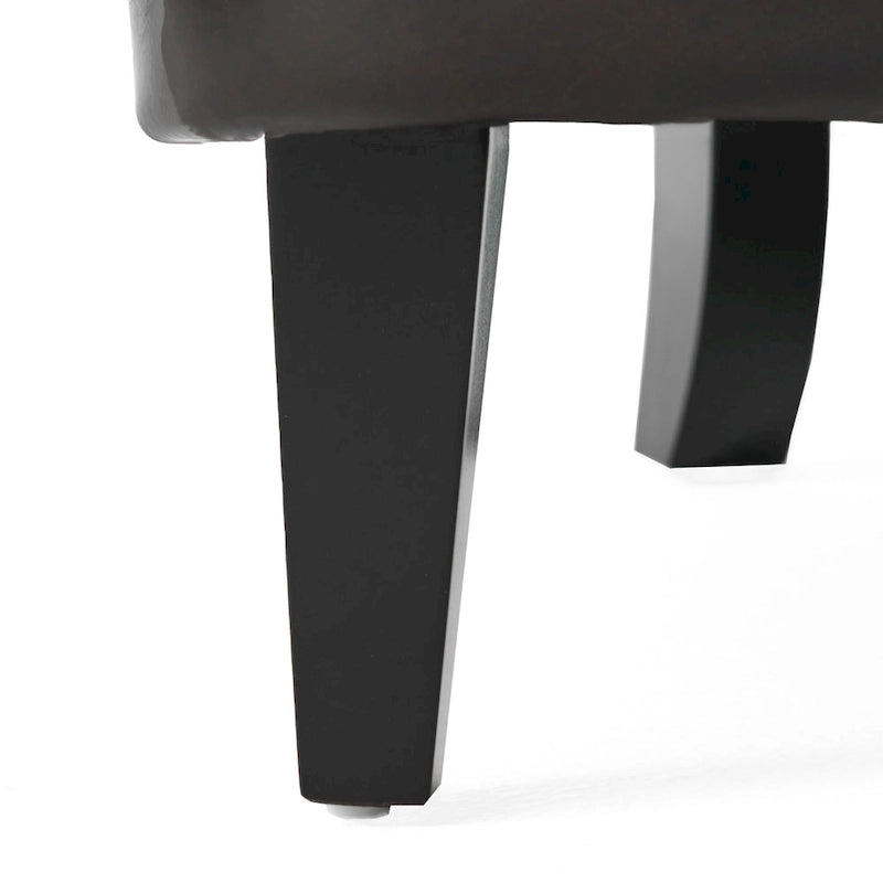 Fauteuil club capitonné en cuir marron surdimensionné
